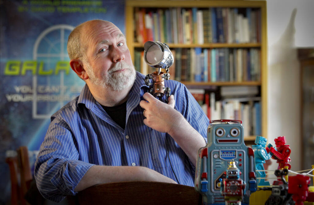 Petaluma playwright and Argus-Courier Community Editor David Templeton poses with a variety of robots Wednesday, March 2, 2022, at his home in Petaluma. Templeton was recently named one of five finalists for the Steinberg/ATCA New Play Award for his "robot play,“ “Galatea.” (CRISSY PASCUAL/ARGUS-COURIER STAFF)