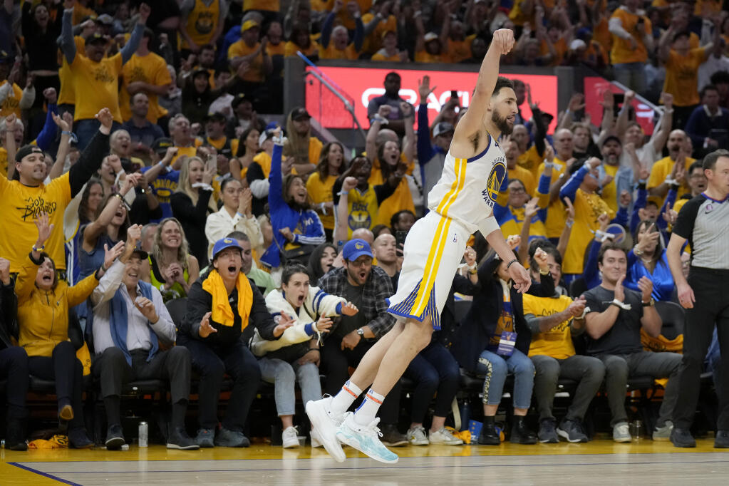 Nancy Pelosi and her husband, Paul Pelosi, from bottom left, celebrate as Golden State Warriors guard Klay Thompson gestures after making a 3-point basket against the Sacramento Kings during the second half of Game 4 in the first round of the NBA basketball playoffs in San Francisco, Sunday, April 23, 2023. (AP Photo/Jeff Chiu)