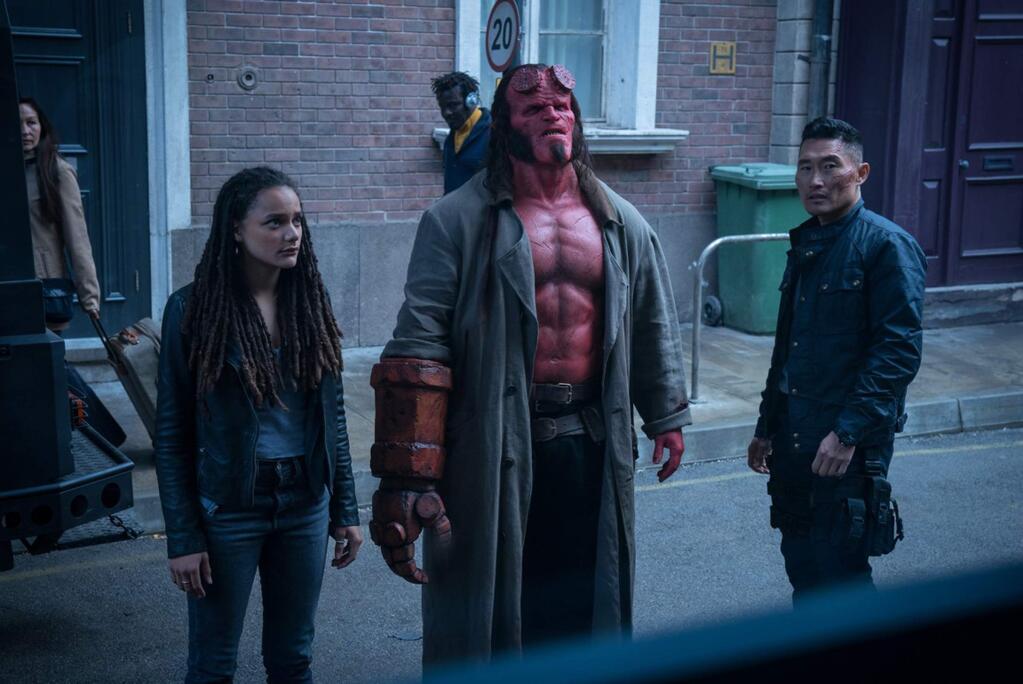 Summit EntertainmentSasha Lane as Alice Monaghan, David Harbour as Hellboy and Daniel Dae Kim as Ben Daimio in 'Hellboy,' in which the legendary half-demon superhero is called upon to the English countryside to battle a trio of rampaging giants.