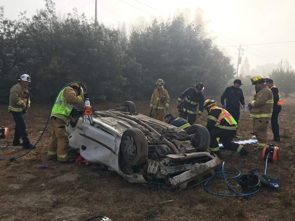 Firefighters work to extricate a Santa Rosa woman from her car following a crash west of Santa Rosa, Sunday, Nov. 10, 2019. (GRATON FIRE DEPARTMENT)