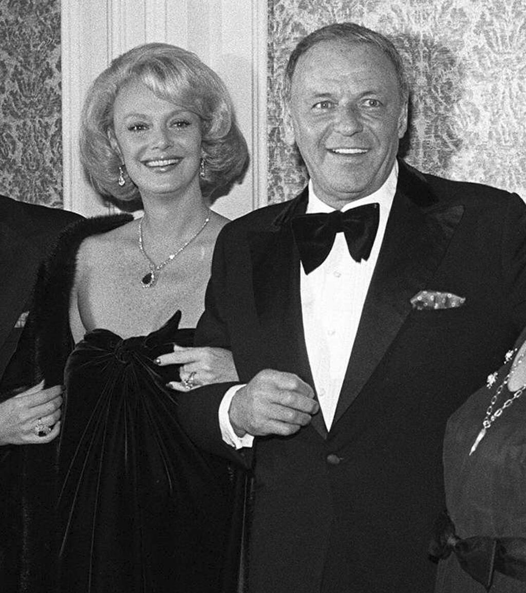 FILE - In this 1976 file photo, Barbara Sinatra poses with her husband Frank Sinatra. Barbara Sinatra, a prominent advocate and philanthropist for abused children, died Tuesday, July 25, 2017, of natural causes at her Rancho Mirage, California, home. She was 90. (AP Photo/File)