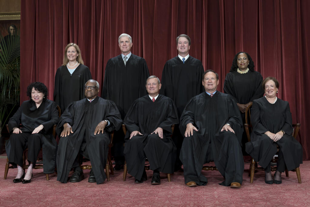 Members of the Supreme Court sit for a new group portrait following the addition of Associate Justice Ketanji Brown Jackson, at the Supreme Court building in Washington, Friday, Oct. 7, 2022. Bottom row, from left, Associate Justice Sonia Sotomayor, Associate Justice Clarence Thomas, Chief Justice of the United States John Roberts, Associate Justice Samuel Alito, and Associate Justice Elena Kagan. Top row, from left, Associate Justice Amy Coney Barrett, Associate Justice Neil Gorsuch, Associate Justice Brett Kavanaugh, and Associate Justice Ketanji Brown Jackson. (AP Photo/J. Scott Applewhite)