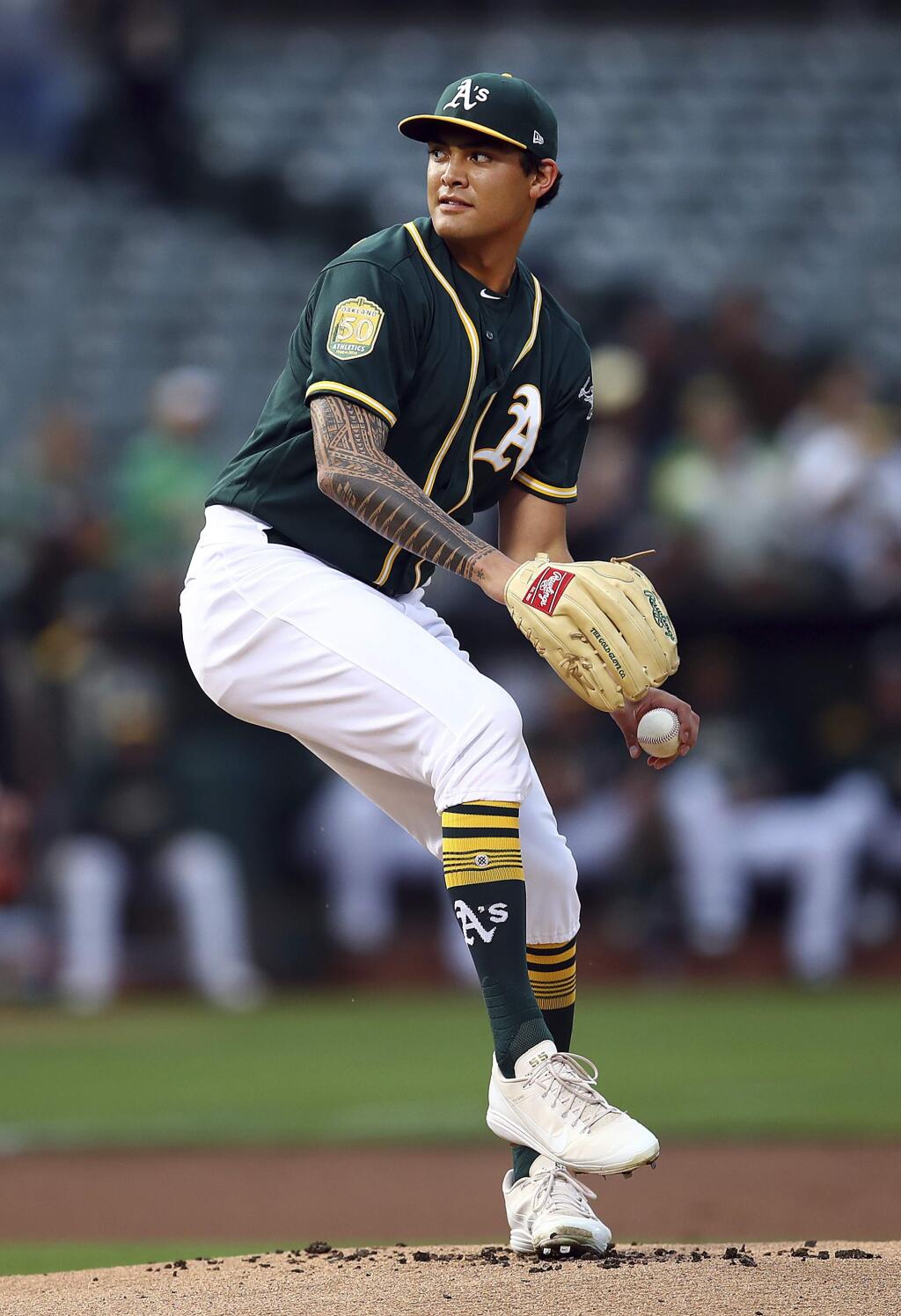 Oakland Athletics pitcher Sean Manaea works against the Seattle Mariners in the first inning of a baseball game Monday, Aug. 13, 2018, in Oakland, Calif. (AP Photo/Ben Margot)