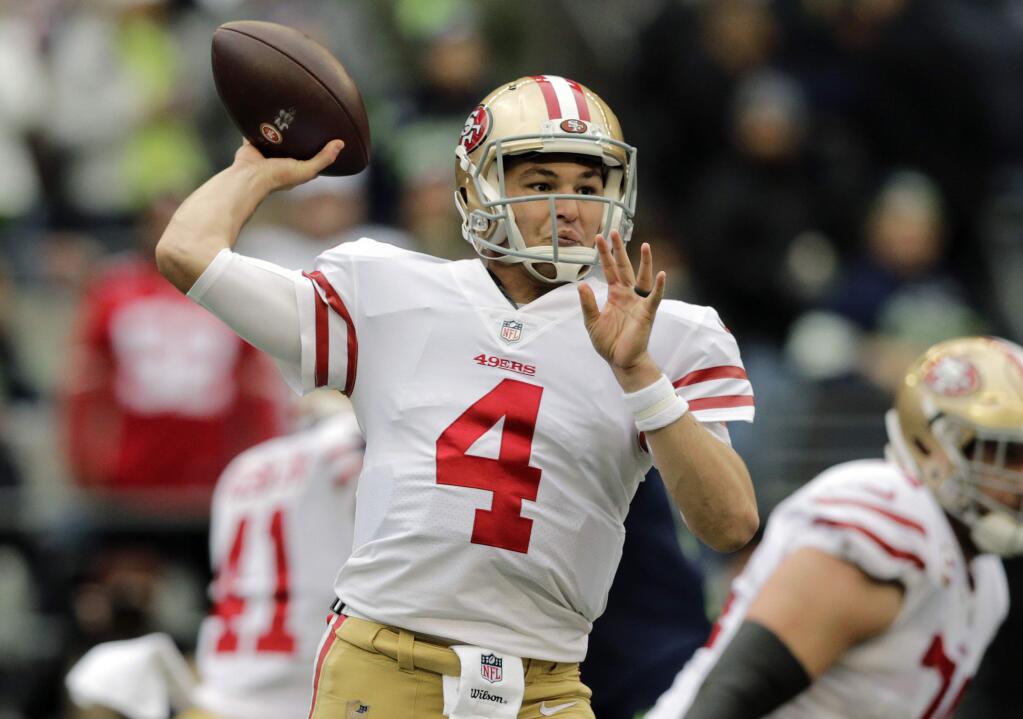 San Francisco 49ers quarterback Nick Mullens passes against the Seattle Seahawks during the first half Sunday, Dec. 2, 2018, in Seattle. (AP Photo/John Froschauer)