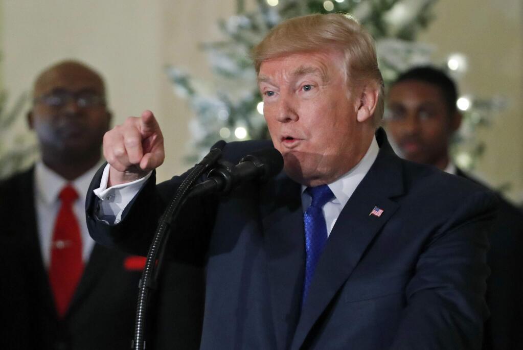 President Donald Trump speaks about tax reform in the Grand Foyer of the White House, Wednesday, Dec. 13, 2017, in Washington. (AP Photo/Alex Brandon)