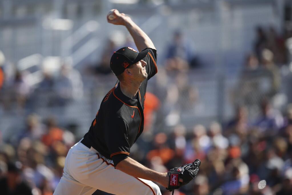 San Francisco Giants starting pitcher Drew Smyly throws against the Arizona Diamondbacks during the first inning of a spring training baseball game Monday, Feb. 24, 2020, in Scottsdale, Ariz. (AP Photo/Ross D. Franklin)