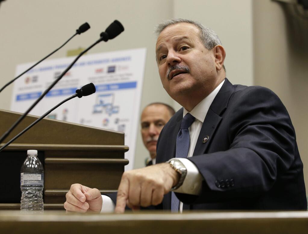 Mark Ghilarducci, director of the California Office of Emergency Services, tells lawmakers that public safety warnings are being hurt by the vulnerability of cellphone service and other privately run communications., Monday, Dec. 4, 2017, in Sacramento, Calif. Ghilarducci, and Ken Pimlott, left, director of the California Department of Forestry and Fire Protection discussed the communications problems encountered while battling the recent wildfires that swept through several Northern California counties in October, while appearing before a joint legislative hearing. (AP Photo/Rich Pedroncelli)