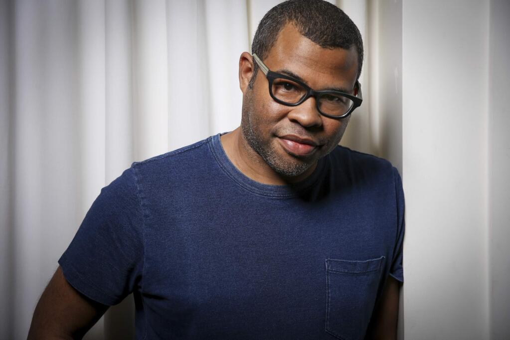 FILE - In this Feb. 9, 2017 file photo, director Jordan Peele poses for a portrait at the SLS Hotel in Los Angeles to promote his film, 'Get Out'. Peele is following up the remarkable success of “Get Out” with a provocative original thriller set for release in March 2019. Universal Pictures announced the release date for Peele's untitled film on Monday, May 22. (Photo by Rich Fury/Invision/AP, File)