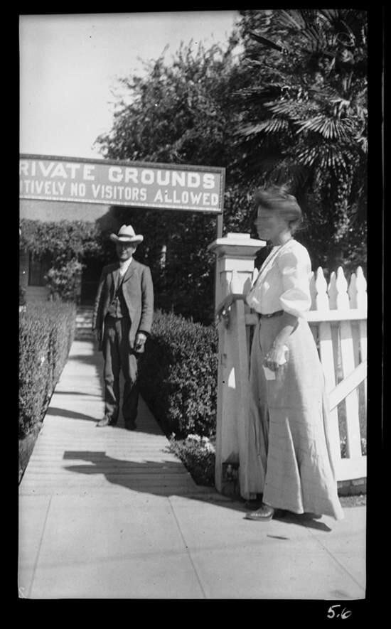 Luther Burbank and Charmain London stand near a sign meant to keep strangers from wandering into Burbank's famed Santa Rosa gardens. (California State Parks, 2016)