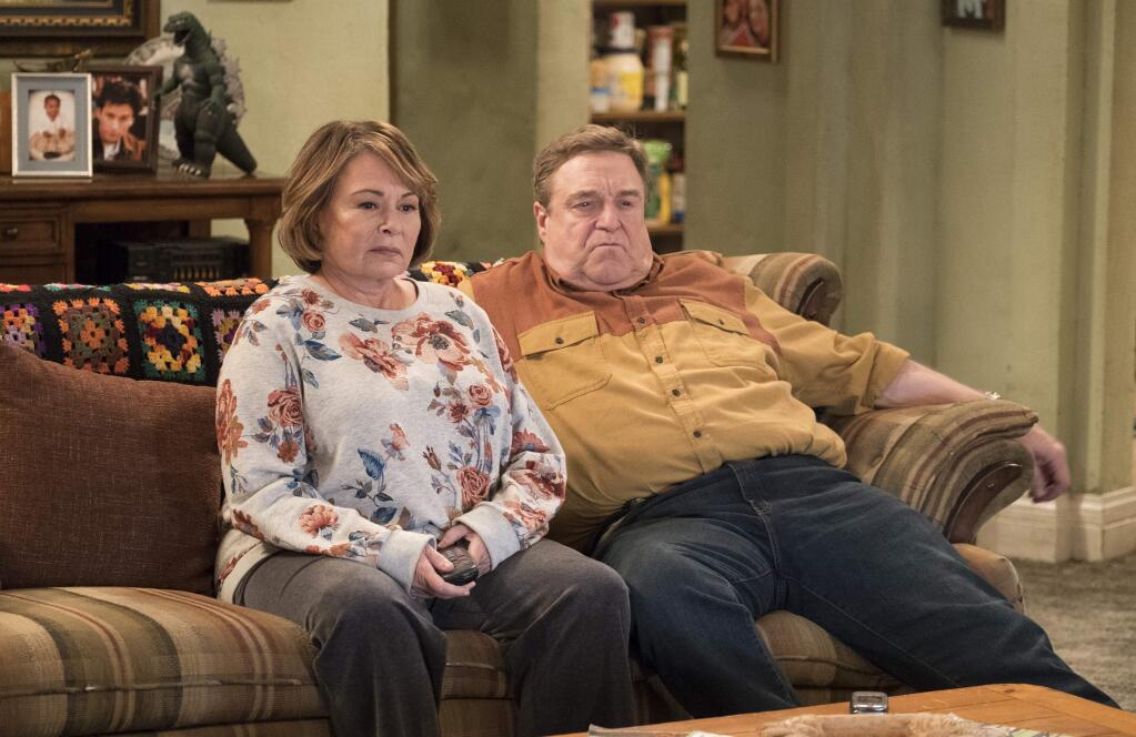 In this image released by ABC, Roseanne Barr, left, and John Goodman appear in a scene from the reboot of 'Roseanne,' premiering on Tuesday at 8 p.m. EST. (Adam Rose/ABC via AP)