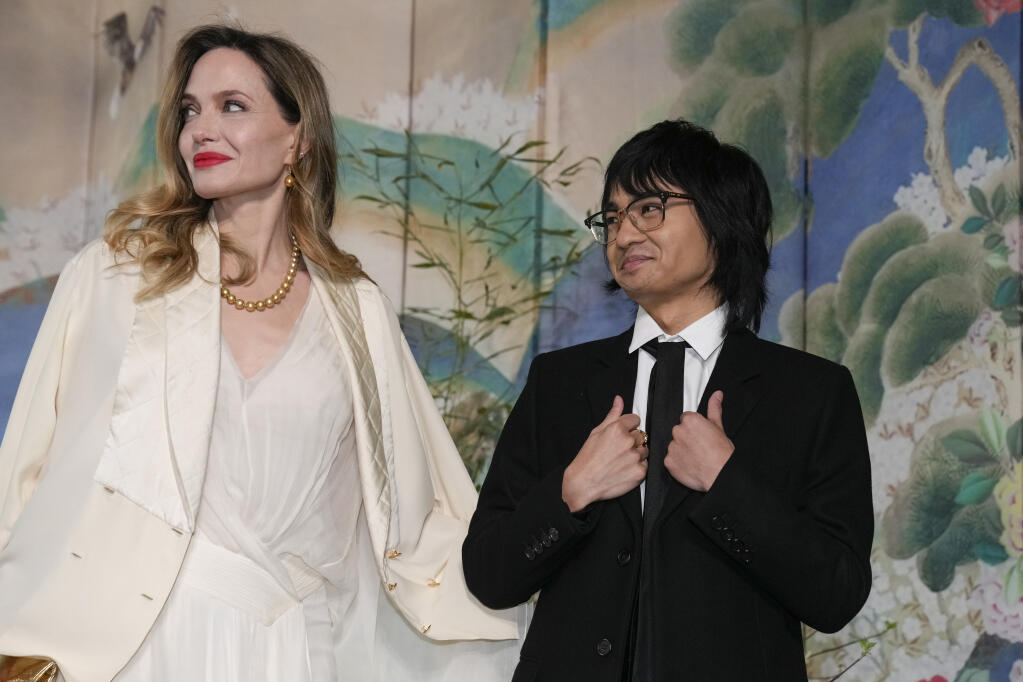 Angelina Jolie and Maddox Jolie-Pitt arrive for the State Dinner with President Joe Biden and the South Korea's President Yoon Suk Yeol at the White House, Wednesday, April 26, 2023, in Washington. (AP Photo/Alex Brandon)