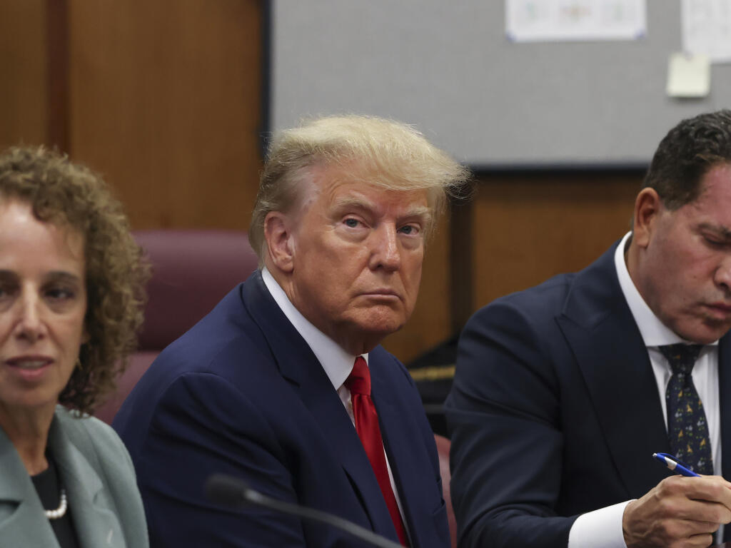 Former President Donald Trump appears in court for his arraignment, Tuesday, April 4, 2023, in New York. Trump surrendered to authorities ahead of his arraignment on criminal charges stemming from a hush money payment to a porn actor during his 2016 campaign. (Andrew Kelly/Pool Photo via AP)