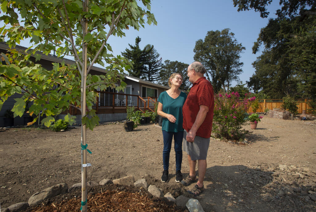 Mike and Jane Witkowski with a newly planted maple tree in their back garden on Sunday, Sept. 19, 2020. (Robbi Pengelly/Index-Tribune)
