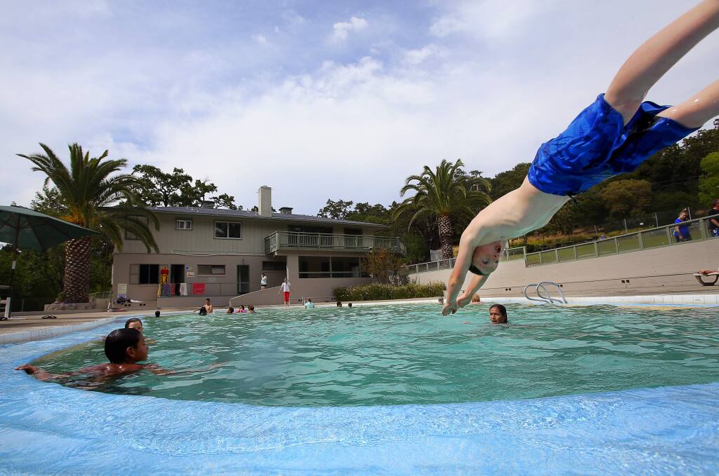 Oisin Heffernan, 9, dives into the pool at Morton's Warm Springs, in Glen Ellen, on Wednesday, July 1, 2015. (Christopher Chung/ The Press Democrat)