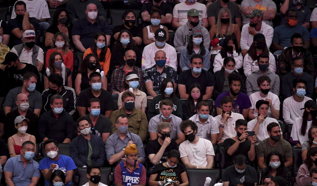 Basketball fans wearing masks due to the coronavirus pandemic look on in the first half of game four of the Western Conference second-round NBA basketball playoff basketball game between the LA Clippers and the Utah Jazz at the Staples Center in Los Angeles on Monday, June 14, 2021. (Photo by Keith Birmingham, Pasadena Star-News/ SCNG)