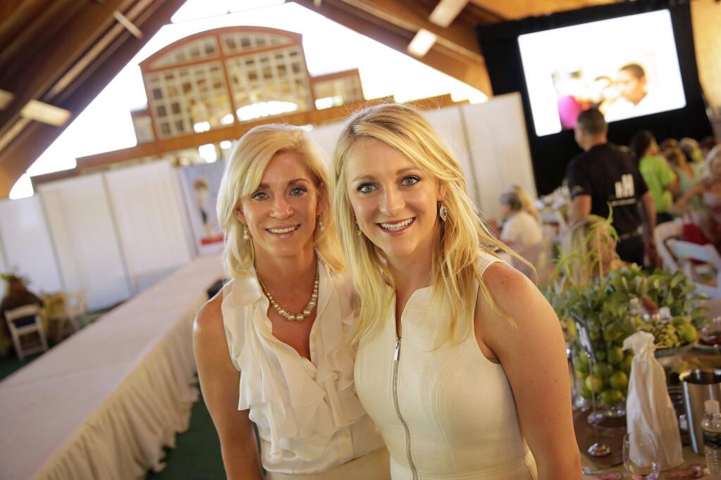 Alicia Manson, left, and her daughter Alex Manson attend the Wine Women & Shoes fundraiser at Chalk Hill Winery in Healdsburg on Saturday, July 26, 2014. (Conner Jay/The Press Democrat)