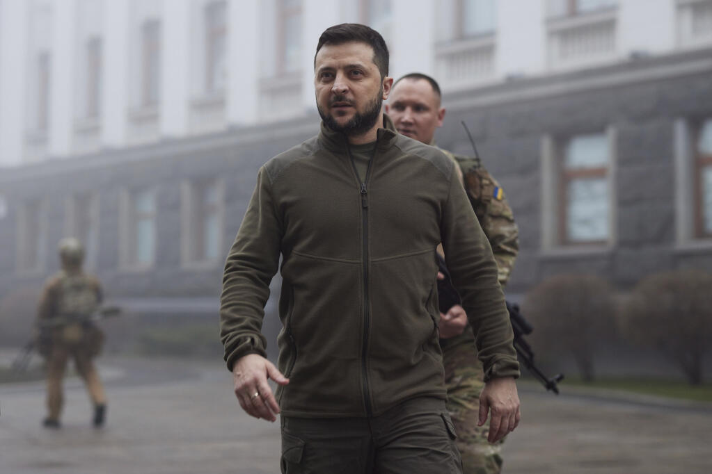 FILE - In this photo provided by the Ukrainian Presidential Press Office, Ukrainian President Volodymyr Zelenskyy, center, walks before a meeting with President of the European Parliament Roberta Metsola in Kyiv, Ukraine, April 1, 2022. Kyiv was a Russian defeat for the ages. It started poorly for the invaders and went downhill from there.  (Ukrainian Presidential Press Office via AP, File)