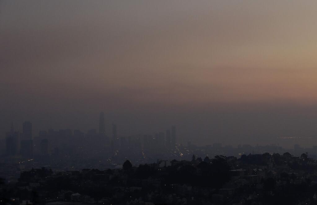 Smoke from regional wildfires obscures the skyline in San Francisco, Thursday, Oct. 12, 2017. (AP Photo/Jeff Chiu)