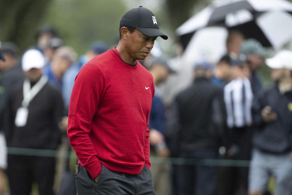 FILE - In this Monday, Sept. 10, 2018, file photo, Tiger Woods walks down a hole during the BMW Championship golf tournament at the Aronimink Golf Club in Newtown Square, Pa. Woods once took for granted that he would end his season at the Tour Championship. Now, just being at East Lake feels like an accomplishment. (AP Photo/Chris Szagola, File)