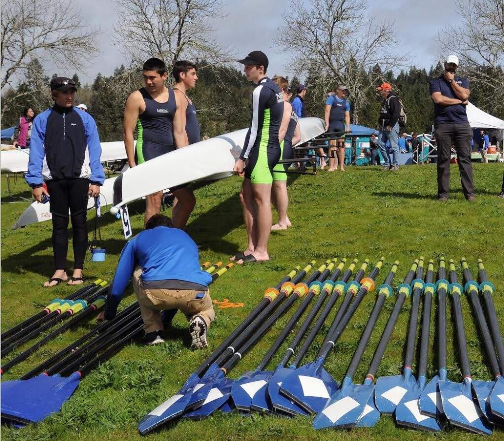 ANNA-CLAIRE DECKER PHOTOWhile head coach Will Whalen, right, looks on, North Bay Rowing Club members prepare for Covered Bridge Regatta in Eugene.