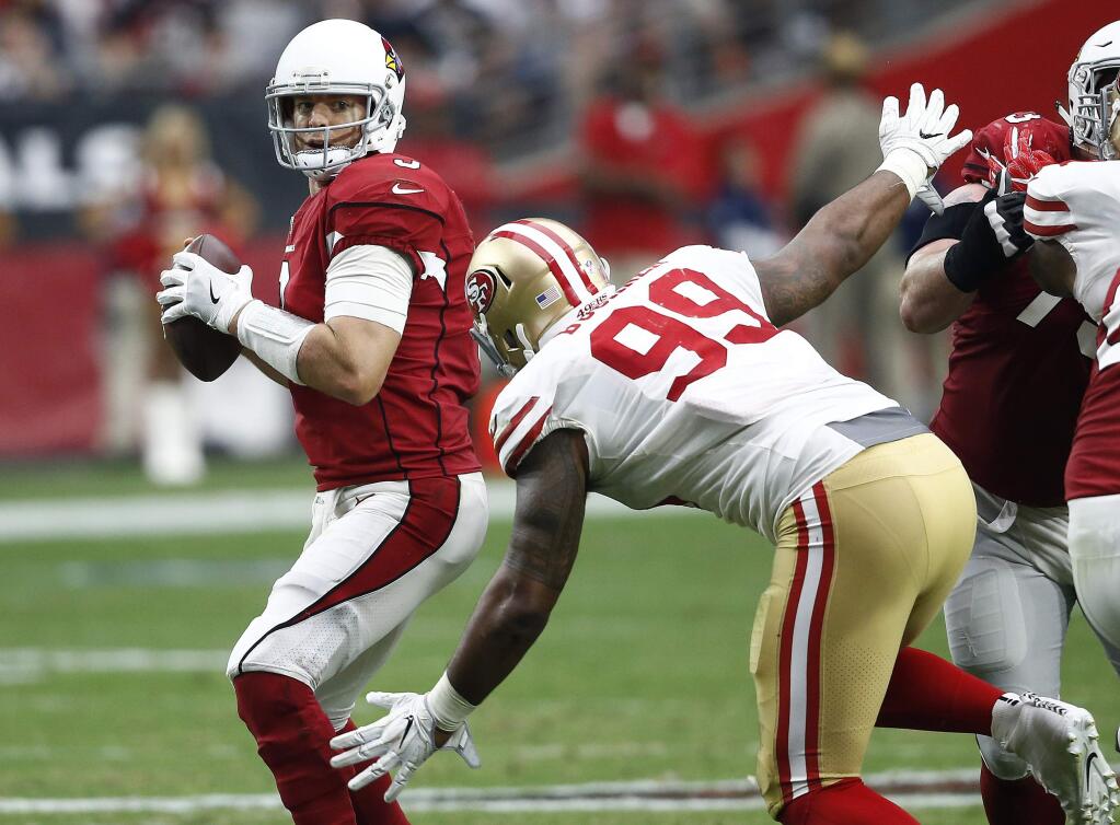 Arizona Cardinals quarterback Carson Palmer is sacked by San Francisco 49ers defensive tackle DeForest Buckner during the second half Sunday, Oct. 1, 2017, in Glendale, Ariz. (AP Photo/Ross D. Franklin)