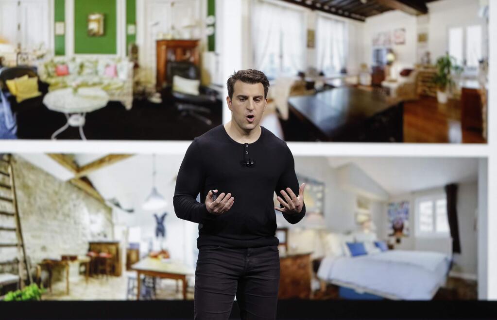 Airbnb co-founder and CEO Brian Chesky speaks during an event Thursday, Feb. 22, 2018, in San Francisco. Airbnb is dispatching inspectors to rate a new category of properties listed on its home-rental service in an effort to reassure travelers they're booking nice places to stay. The Plus program, unveiled Thursday, initially will only cover about 2,000 homes in 13 cities. That's a small fraction of the roughly 4.5 million rentals listed on Airbnb in 81,000 of cities throughout the world. (AP Photo/Eric Risberg)