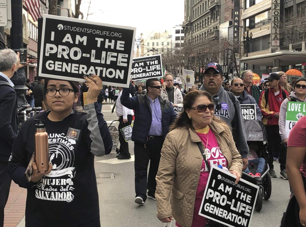 Thousands of abortion opponents march in the 15th annual Walk for Life across downtown San Francisco Saturday, Jan. 26, 2019. The event, which included a Roman Catholic Mass and a rally at Civic Center Plaza, was held close to the 46th anniversary of the U.S. Supreme Court's Roe v. Wade decision that legalized abortion. (AP Photo/Juliet Williams)