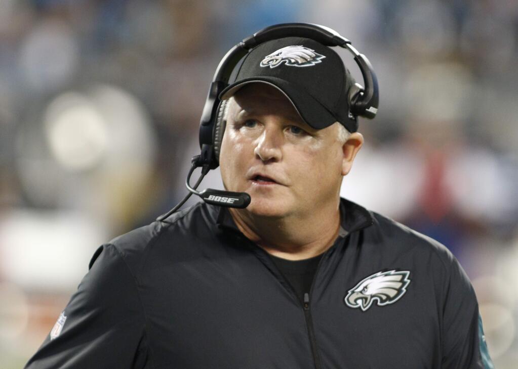 FILE - In this Oct. 25, 2015, file photo, Philadelphia Eagles head coach Chip Kelly watches the action from the sidelines in the first half of an NFL football game against the Carolina Panthers in Charlotte, N.C. The San Francisco 49ers have hired Chip Kelly as their new head coach. CEO Jed York announced the move on Twitter and so did the team. (AP Photo/Bob Leverone, File)