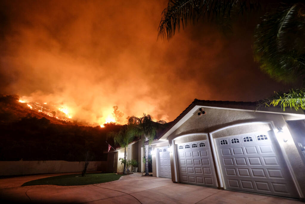 California legislators adjourned for the year without acting on the cost and availability of homeowners insurance in California, where many insurers are cutting back or leaving the state because of climate change-related risks. (RINGO H.W. CHIU / Associated Press, 2018)
