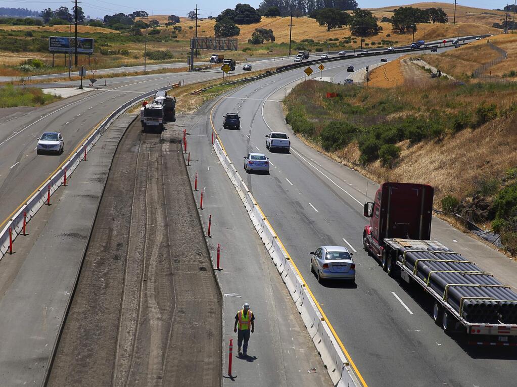 Construction work continues on Highway 101, south of the Petaluma Boulevard South overpass, in Petaluma, on Wednesday, June 22, 2016. (Christopher Chung/ The Press Democrat)