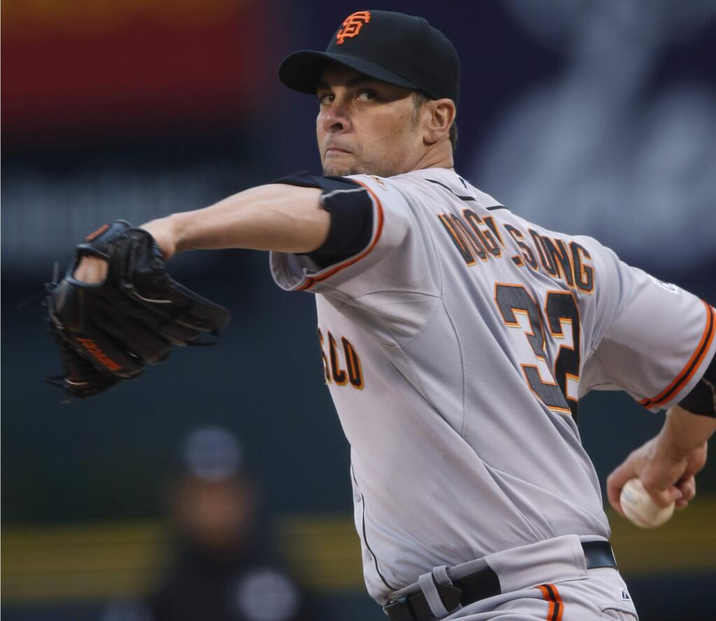 San Francisco Giants starting pitcher Ryan Vogelsong works against the Colorado Rockies in the first inning of a game Friday, May 22, 2015, in Denver. (AP Photo/David Zalubowski)
