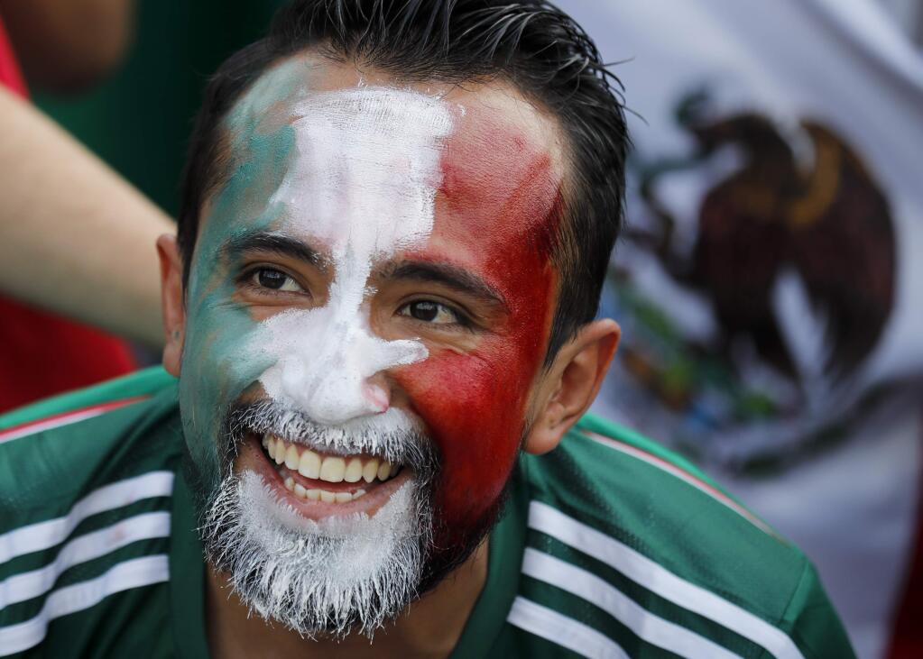 A Mexico's football fan smiles ahead of the group F match between Germany and Mexico at the 2018 soccer World Cup in the Luzhniki Stadium in Moscow, Russia, Sunday, June 17, 2018. (AP Photo/Alexander Zemlianichenko)