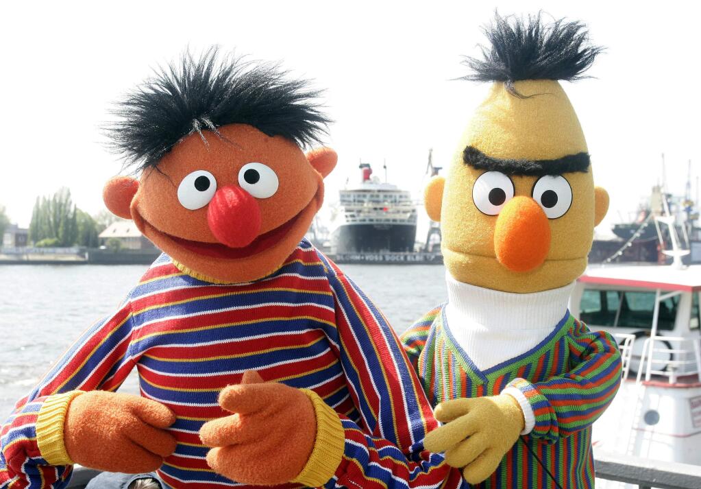 FILE - In this May 9, 2006, file photo, Ernie and Bert of “Sesame Street” pose in front of the Queen Mary II in the harbor of Hamburg, Germany. The producers of “Sesame Street” tweeted Tuesday, Sept. 18, 2018, that Bert and Ernie are not gay in response to a Queerty interview published Sunday, Sept. 16, 2018, with a former writer for the show who said he considered the puppets lovers. (AP Photo/Fabian Bimmer, File)