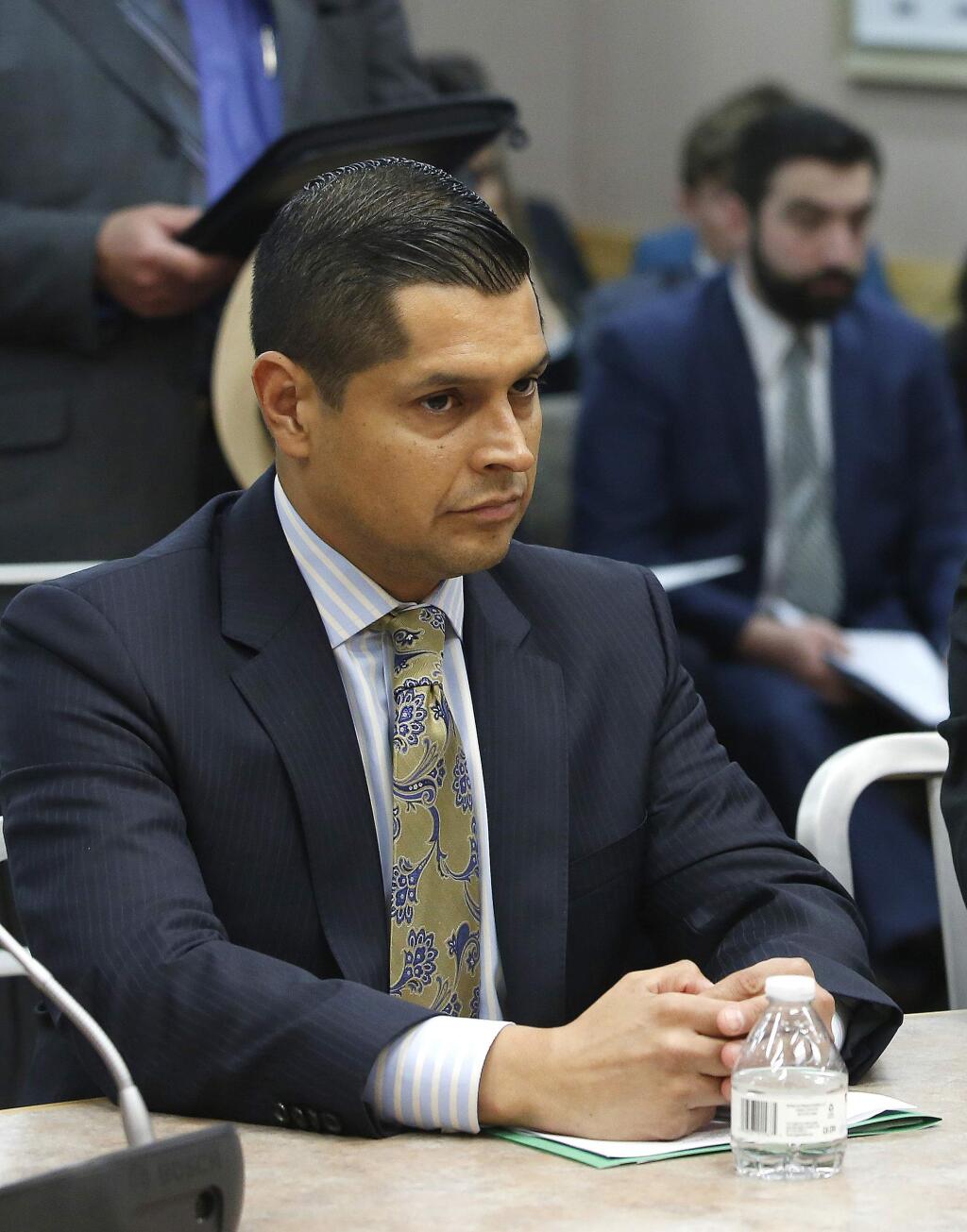 FILE -- In this June 14, 2016 file photo Assemblyman Miguel Santiago, D-Los Angeles, appears before the Senate Public Safety Committee, in Sacramento, Calif. Santiago says, Friday, June 22, 2018, that his family is being harassed online because he altered a bill aimed at restoring net neutrality. (AP Photo/Rich Pedroncelli, file)