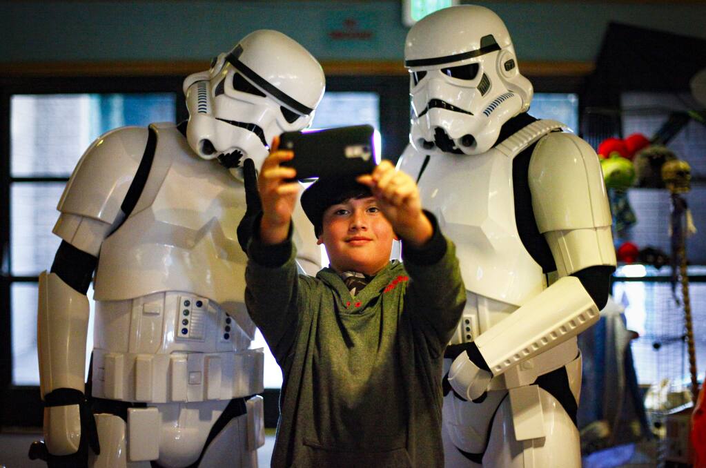 Blake Lopez, 9, takes a selfie with storm troopers from Star Wars at Lumacon on Saturday, Jan. 28, 2017, in Petaluma. (CRISSY PASCUAL/ARGUS-COURIER STAFF)