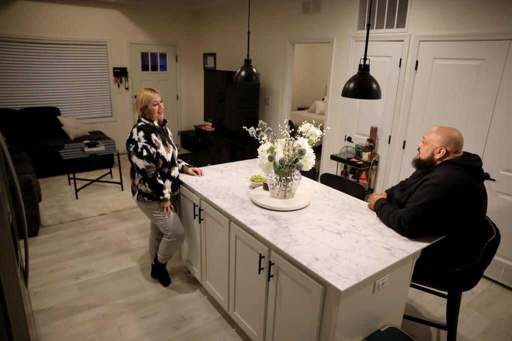 Lala and Rob Maston talk in the kitchen of their brand new three-bedroom ADU (accessory dwelling unit) in Napa, Tuesday, Jan. 23, 2024. (Beth Schlanker / The Press Democrat)