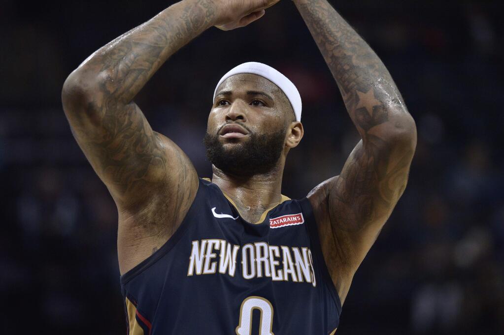 In this Jan. 10, 2018 file photo, New Orleans Pelicans center DeMarcus Cousins shoots a free throw in the first half oagainst the Memphis Grizzlies in Memphis, Tenn. (AP Photo/Brandon Dill, file)