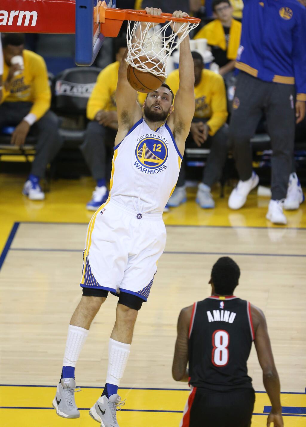 Golden State Warriors center Andrew Bogut dunks the ball on an alley-oop pass against the Portland Trail Blazers, during their game in Oakland on Sunday, May 1, 2016. The Warriors defeated the Trail Blazers 118-106. (Christopher Chung/ The Press Democrat)