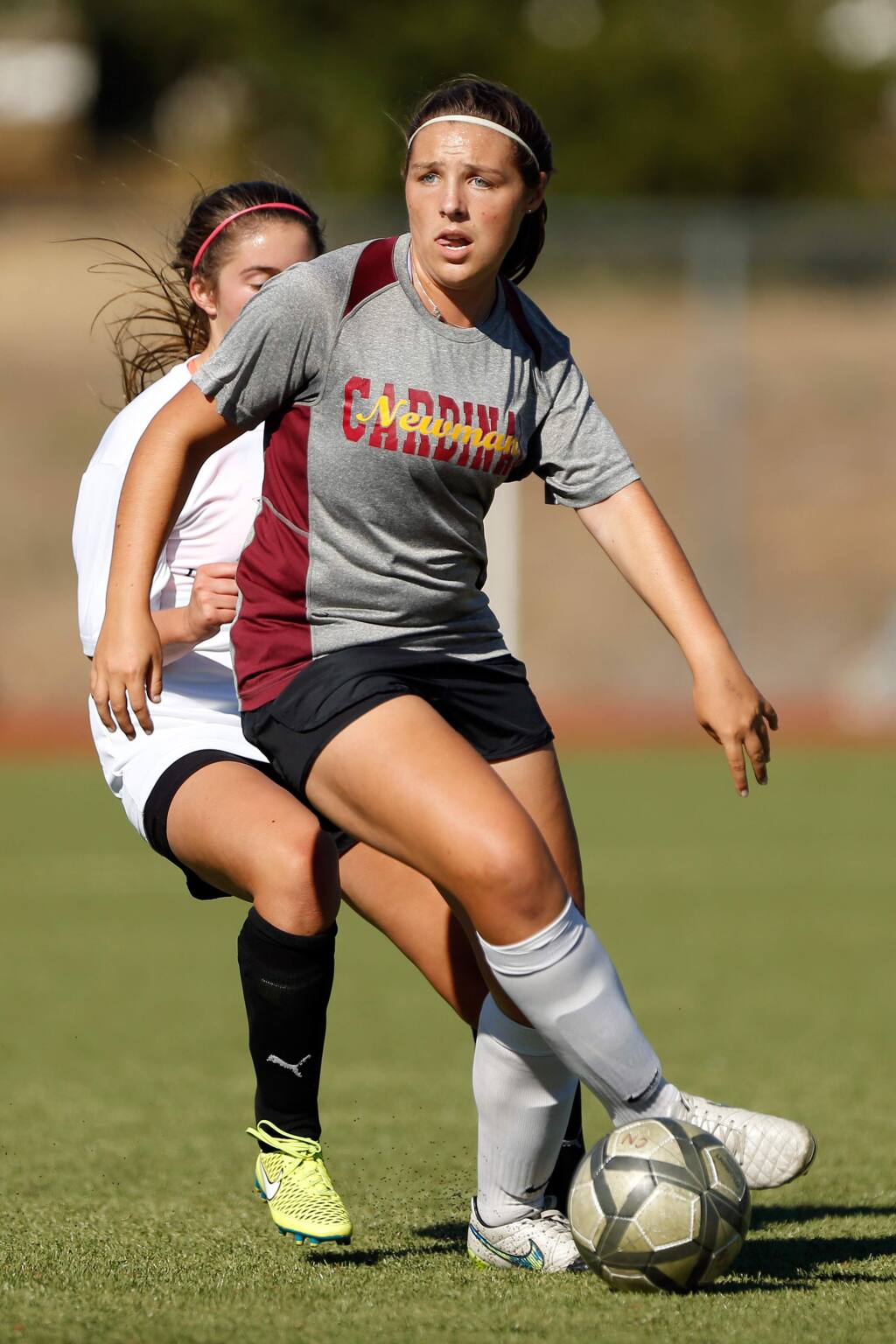 Cardinal Newman's Dani Gilson looks to pass to an open teammate during a girls varsity soccer scrimmage match between Windsor and Cardinal Newman high schools, in Santa Rosa, California on Wednesday, August 31, 2016. (Alvin Jornada / The Press Democrat)