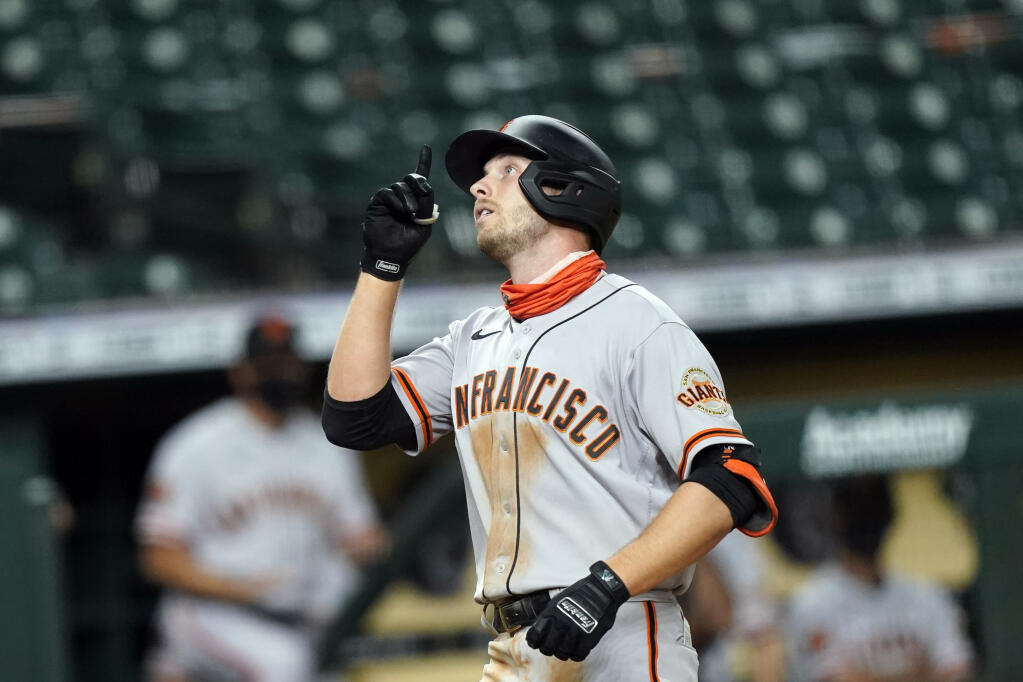 The San Francisco Giants’ Austin Slater celebrates after hitting a home run against the Houston Astros during the eighth inning Monday, Aug. 10, 2020, in Houston. (David J. Phillip / ASSOCIATED PRESS)