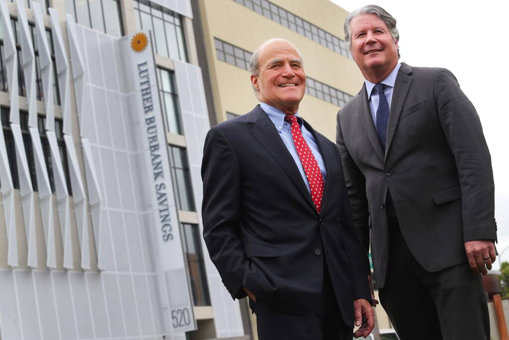 Luther Burbank Savings President and CEO John Biggs, right, and Chairman Victor Trione at the new Luther Burbank Savings headquarters in downtown Santa Rosa, on Tuesday, April 12, 2016. (Christopher Chung / The Press Democrat)