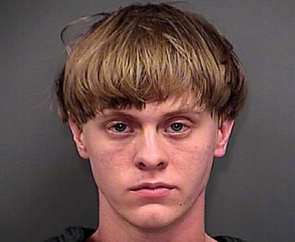 FILE - This Thursday, June 18, 2015, file photo, provided by the Charleston County Sheriff's Office shows Dylann Roof. A federal magistrate in Charleston, S.C., entered not guilty pleas on 33 federal charges, Friday, July 31, 2015, including for hate crimes, for Roof, a white man accused of gunning down nine parishioners at a black church in Charleston. (Charleston County Sheriff's Office via AP)
