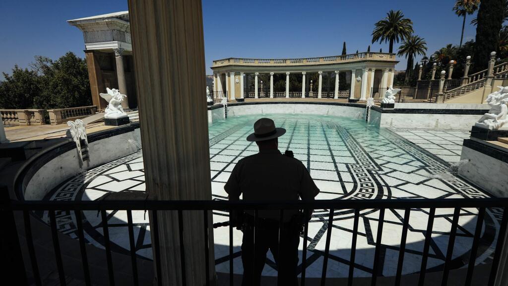 FILE - In this Tuesday, Aug. 14, 2018, file photo Dan Falat, San Luis Obispo Coast District Superintendent of California State Parks, watches as the Neptune Pool at Hearst Castle in San Simeon, Calif., is filled with water. (Joe Johnston/The Tribune (of San Luis Obispo) via AP, File)