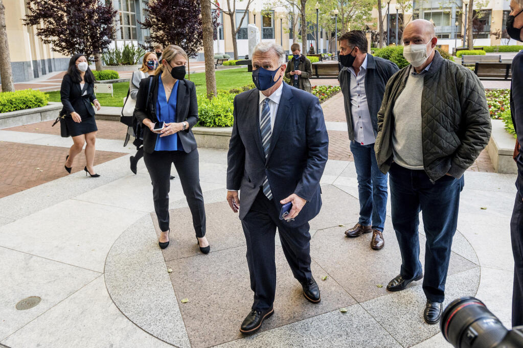 Phil Schiller, an Apple executive, enters the Ronald V. Dellums building in Oakland, Calif., on Monday, May 3, 2021, to attend a federal court case brought by Epic Games. Epic, maker of the video game Fortnite, charges that Apple has transformed its App Store into an illegal monopoly. (AP Photo/Noah Berger)
