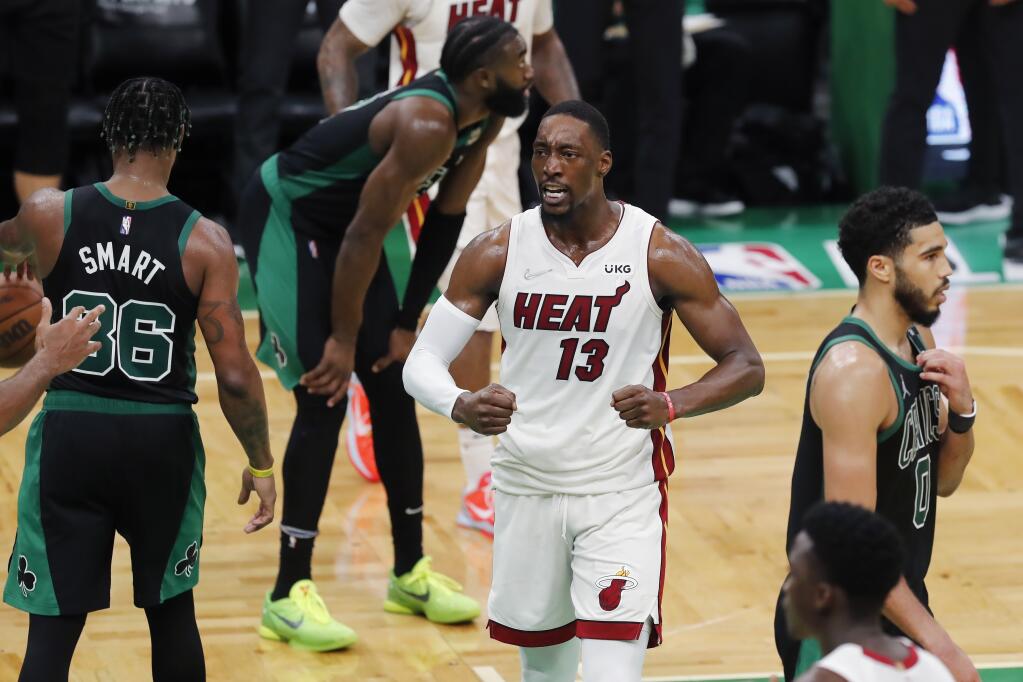 The Miami Heat’s Bam Adebayo celebrates during the second half of Game 6 of the Eastern Conference Finals against the Celtics on Friday, May 27, 2022, in Boston. The Heat won 111-103. (Michael Dwyer / ASSOCIATED PRESS)
