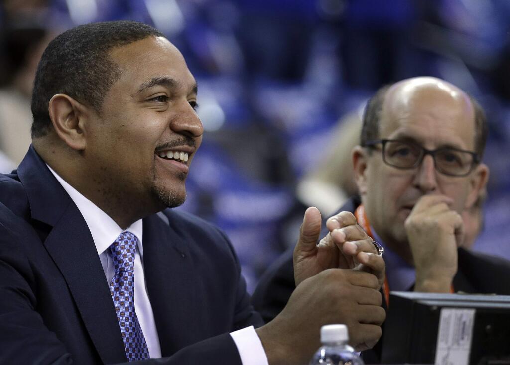 FILE - In this Jan. 9, 2015, file photo, former Golden State Warriors coach Mark Jackson, left, smiles before working as an NBA analyst before an NBA basketball game between the Cleveland Cavaliers and the Warriors in Oakland, Calif. (AP Photo/Ben Margot, File)