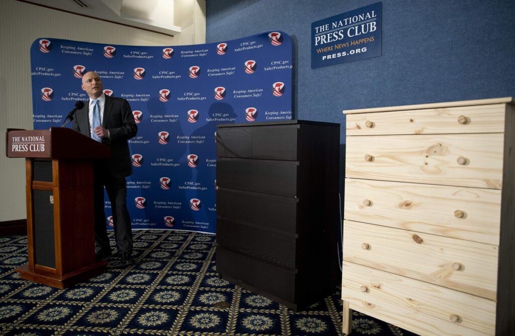 FILE - In this Tuesday, June 28, 2016, file photo, with two Ikea dressers displayed at right, Consumer Product Safety Commission (CPSC) Chairman Elliot Kaye speaks during a news conference at the National Press Club in Washington. (AP Photo/Carolyn Kaster, File)