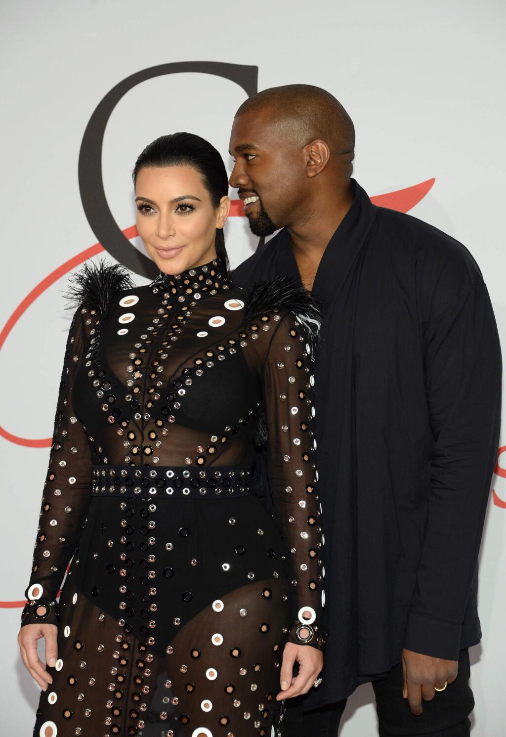 Kim Kardashian, left, and Kanye West arrive at the 2015 CFDA Fashion Awards at Alice Tully Hall, Lincoln Center, on Monday, June 1, 2015, in New York. (Photo by Evan Agostini/Invision/AP)