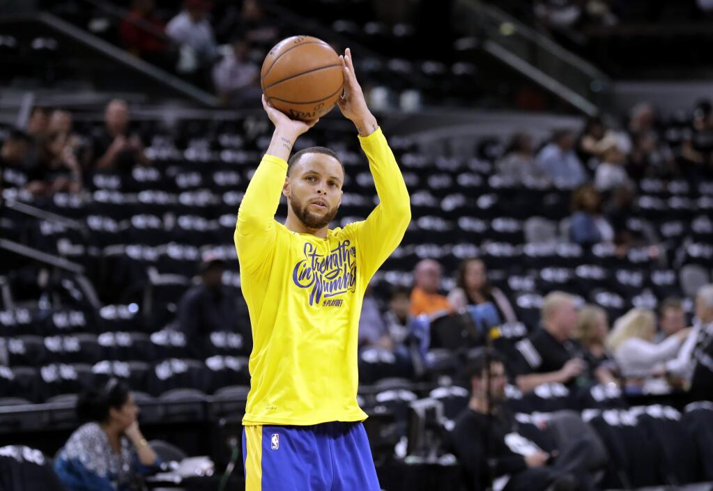 Golden State Warriors guard Stephen Curry warms up before Game 3 of a first-round playoff series against the San Antonio Spurs on Thursday, April 19, 2018, in San Antonio. (AP Photo/Eric Gay)