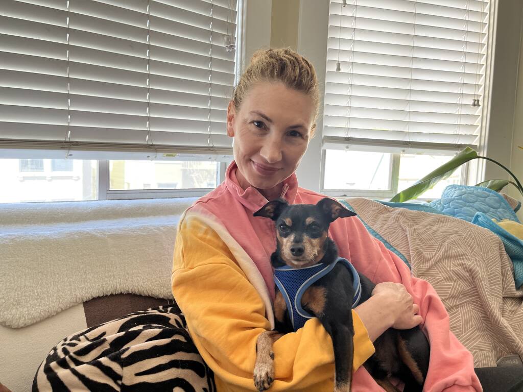 Two months after losing her first dog Roman in September 2020, Kerri Finn adopted Jimmy, a mini pinscher-chihuahua mix who needed therapy working through separation anxiety. Photo by Marji Pearson